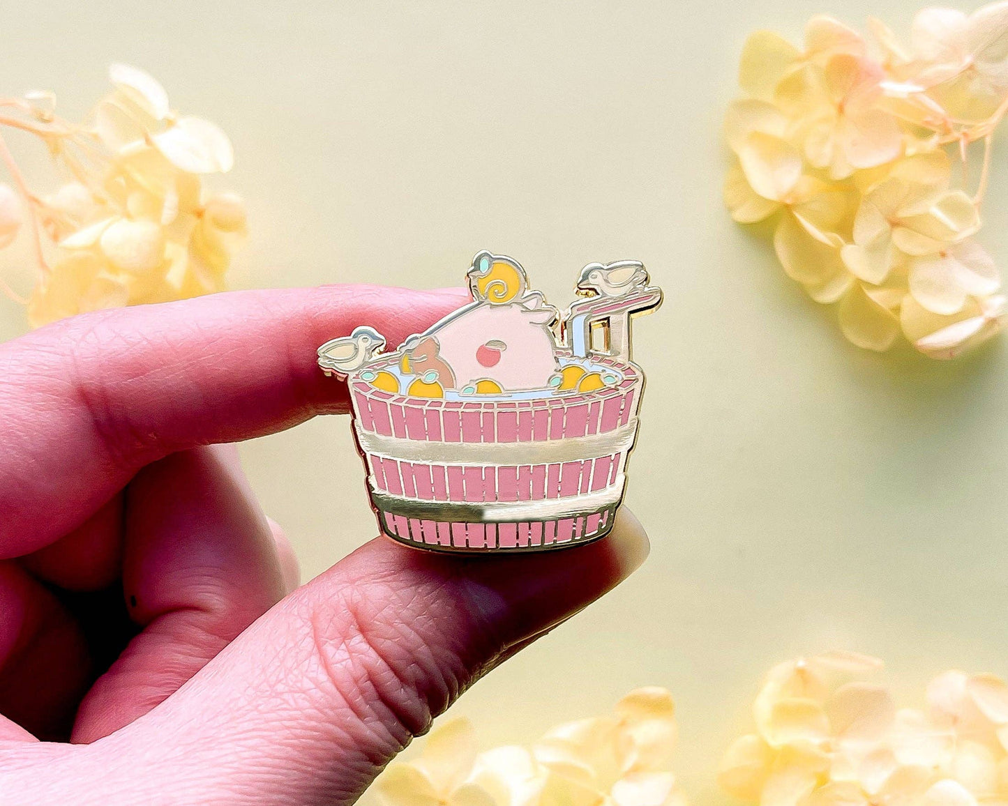 Curly the Capybara in a Bucket Spa Enamel Pin - Gold Plated Base