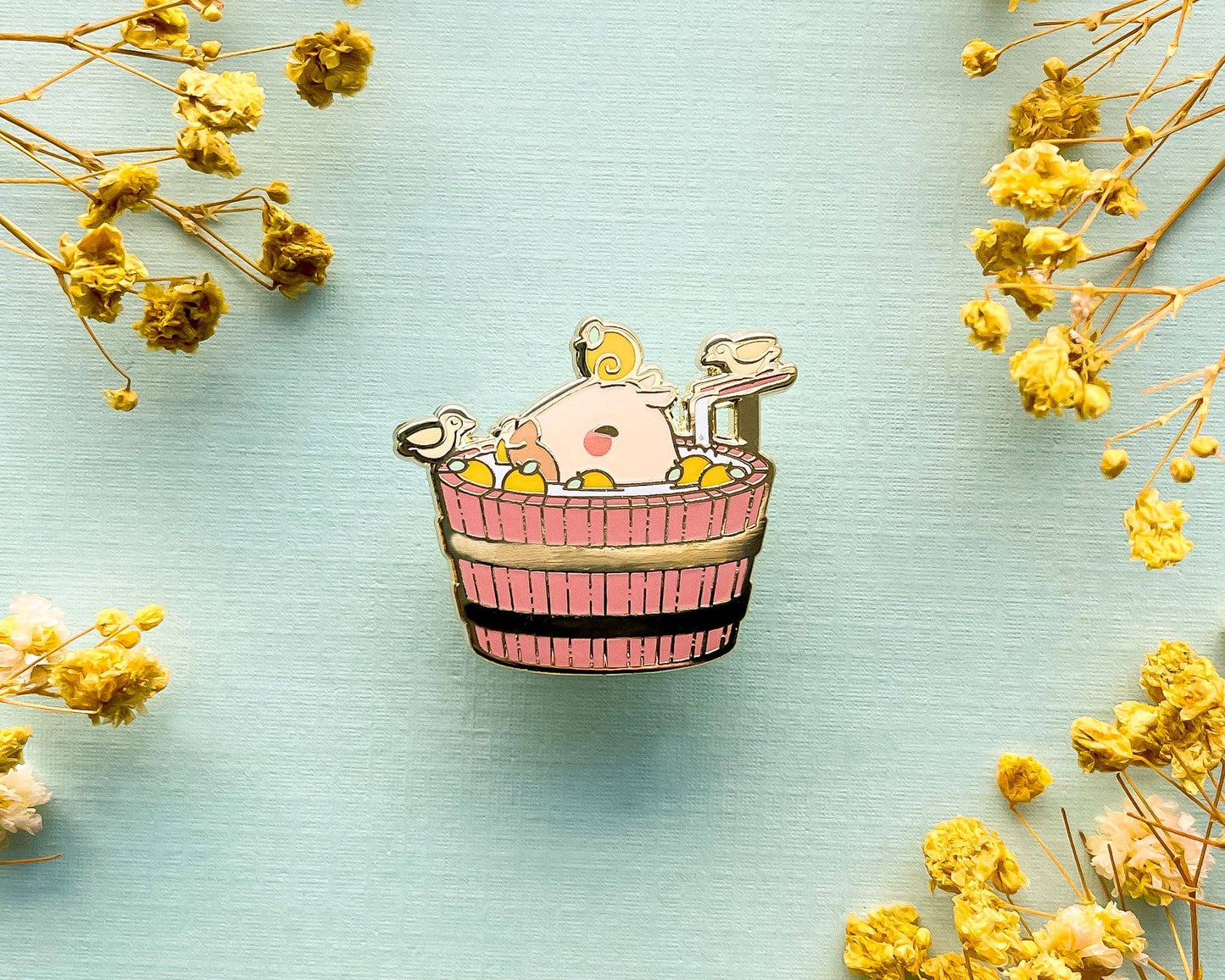 Curly the Capybara in a Bucket Spa Enamel Pin - Gold Plated Base