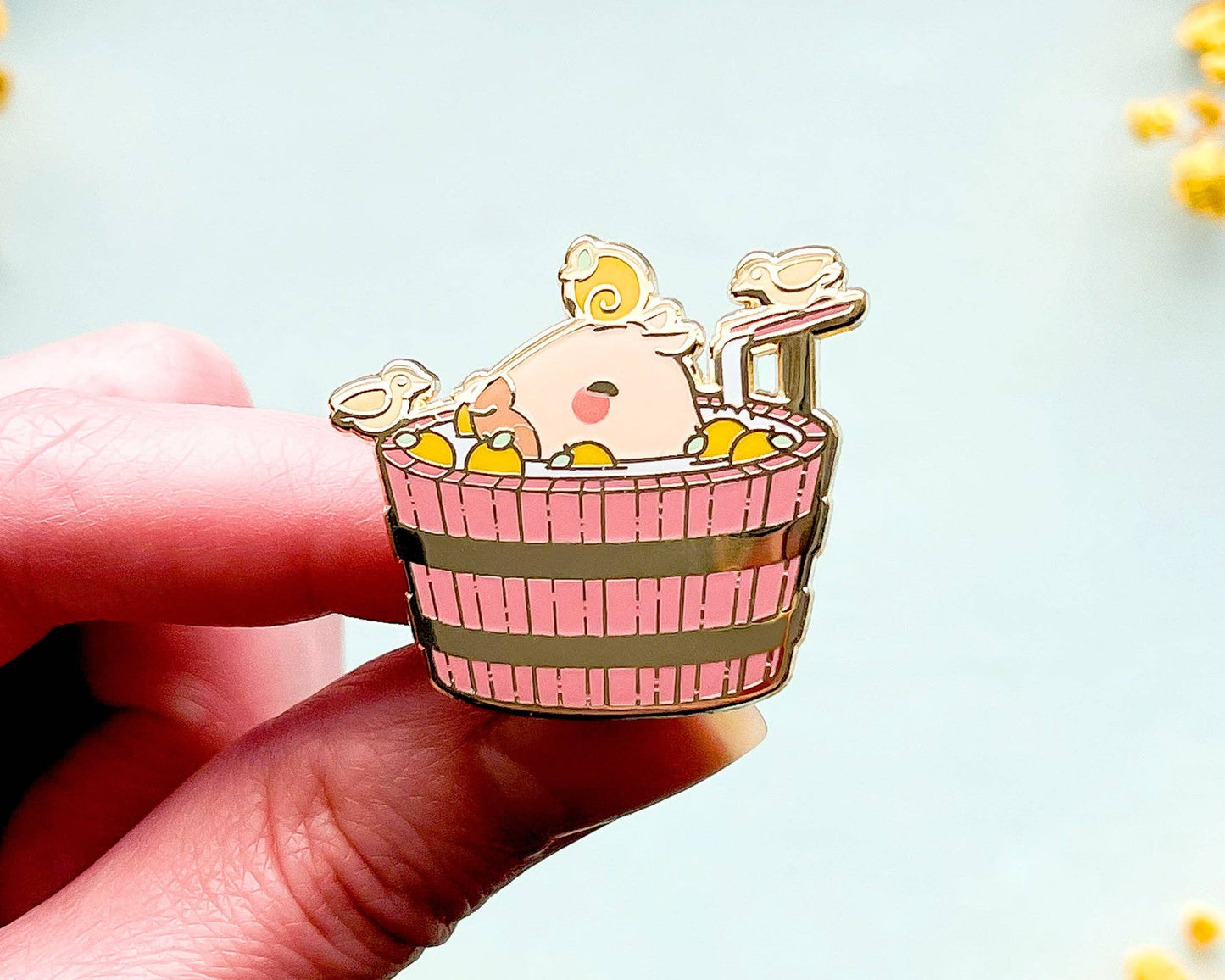 Curly the Capybara in a Bucket Spa Enamel Pin - Gold Plated Base