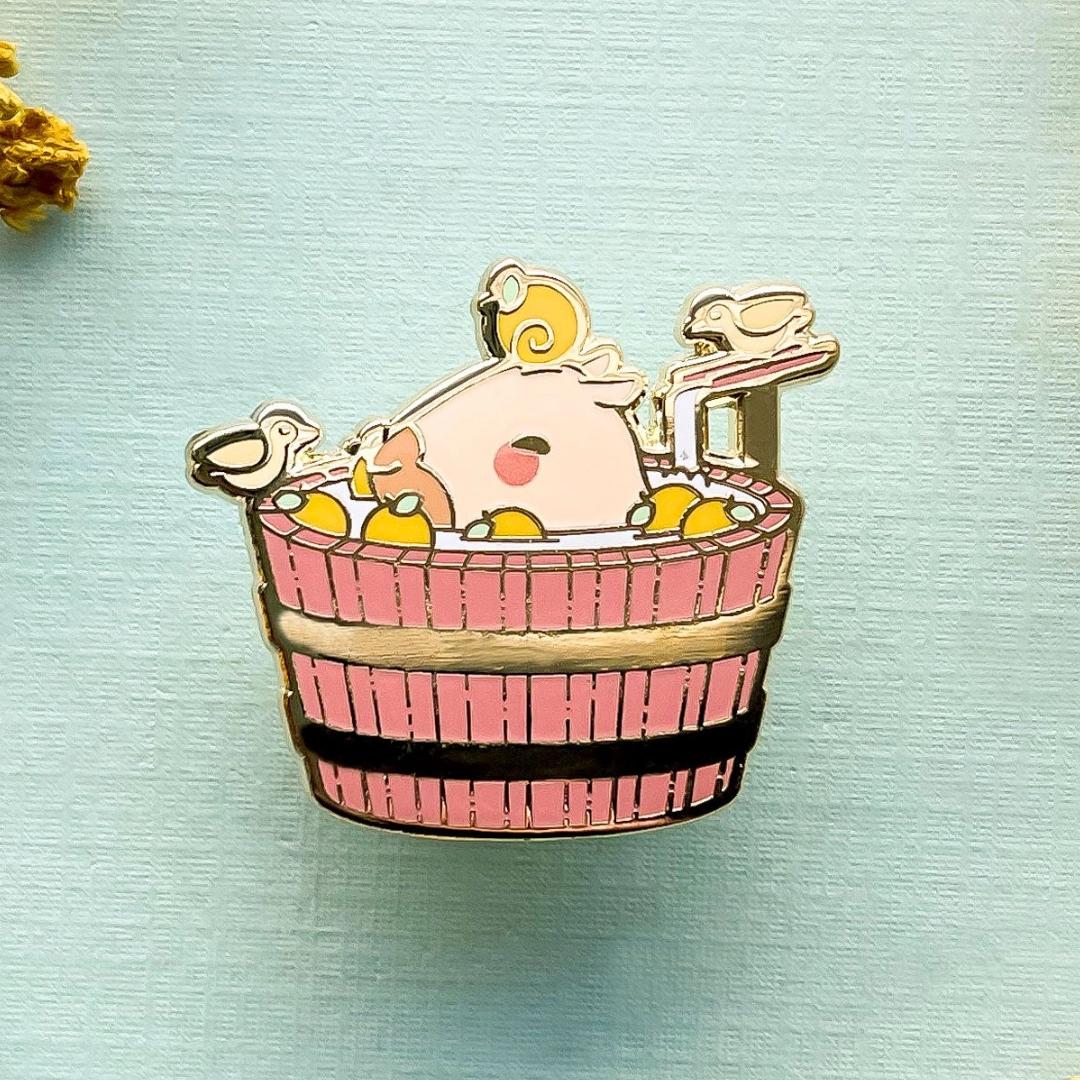 Curly the Capybara in a Bucket Spa Enamel Pin - Gold Plated Base