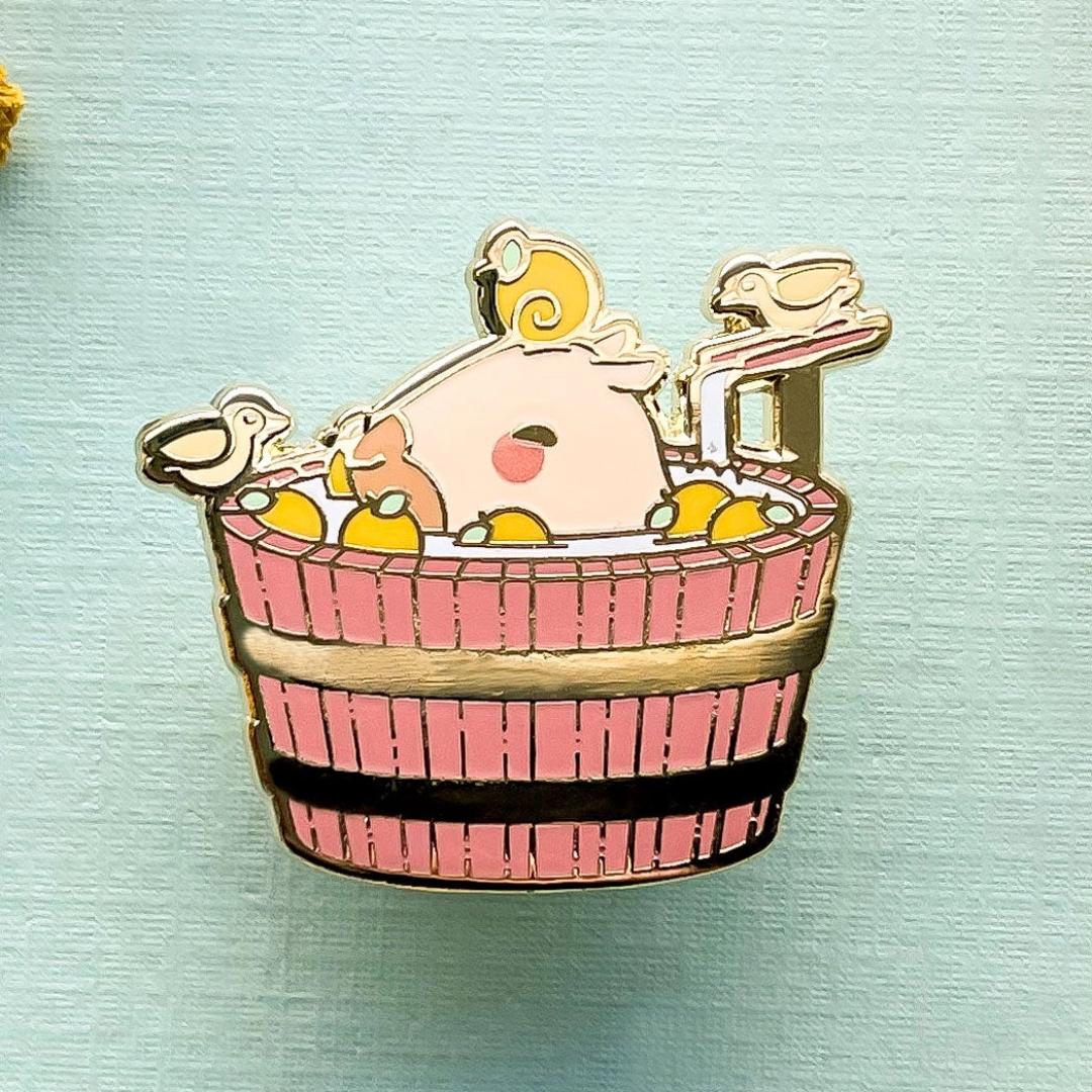 Curly the Capybara in a Bucket Spa Enamel Pin - Gold Plated Base